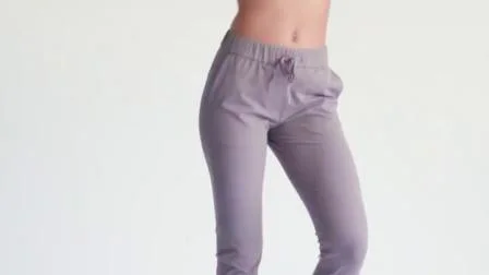 Adaptez aux besoins du client le pantalon de jogging de femmes de coupe mince d'usage de yoga de sport de plissage